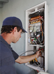 Plumber checks tankless water heater