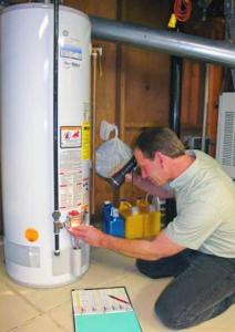 Alameda CA plumber inspects the electrical panel on a water heater